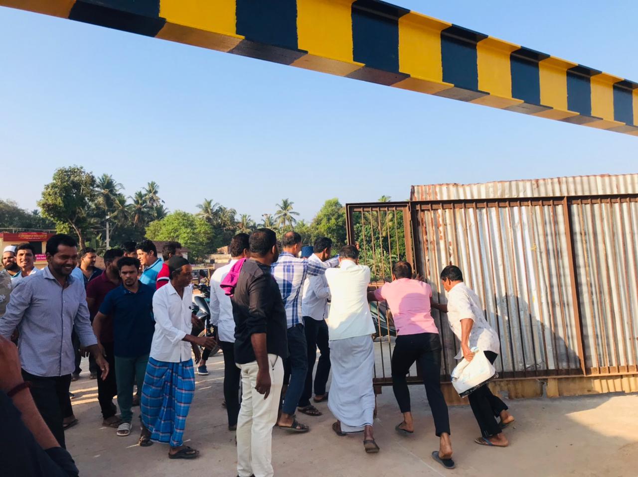 DYFI activists remove gates of Harekala-Adyar bridge, opening it to traffic