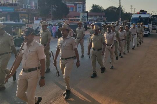 Police and Rapid Action Force conduct march in Bhatkal to remove fear and restore public confidence