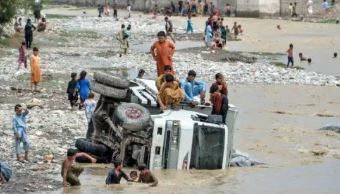 Flash floods due to unusually heavy seasonal rains kill at least 50 people in western Afghanistan