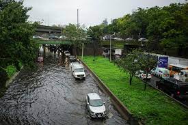 New York City area under state of emergency after storms flood subways, strand people in cars